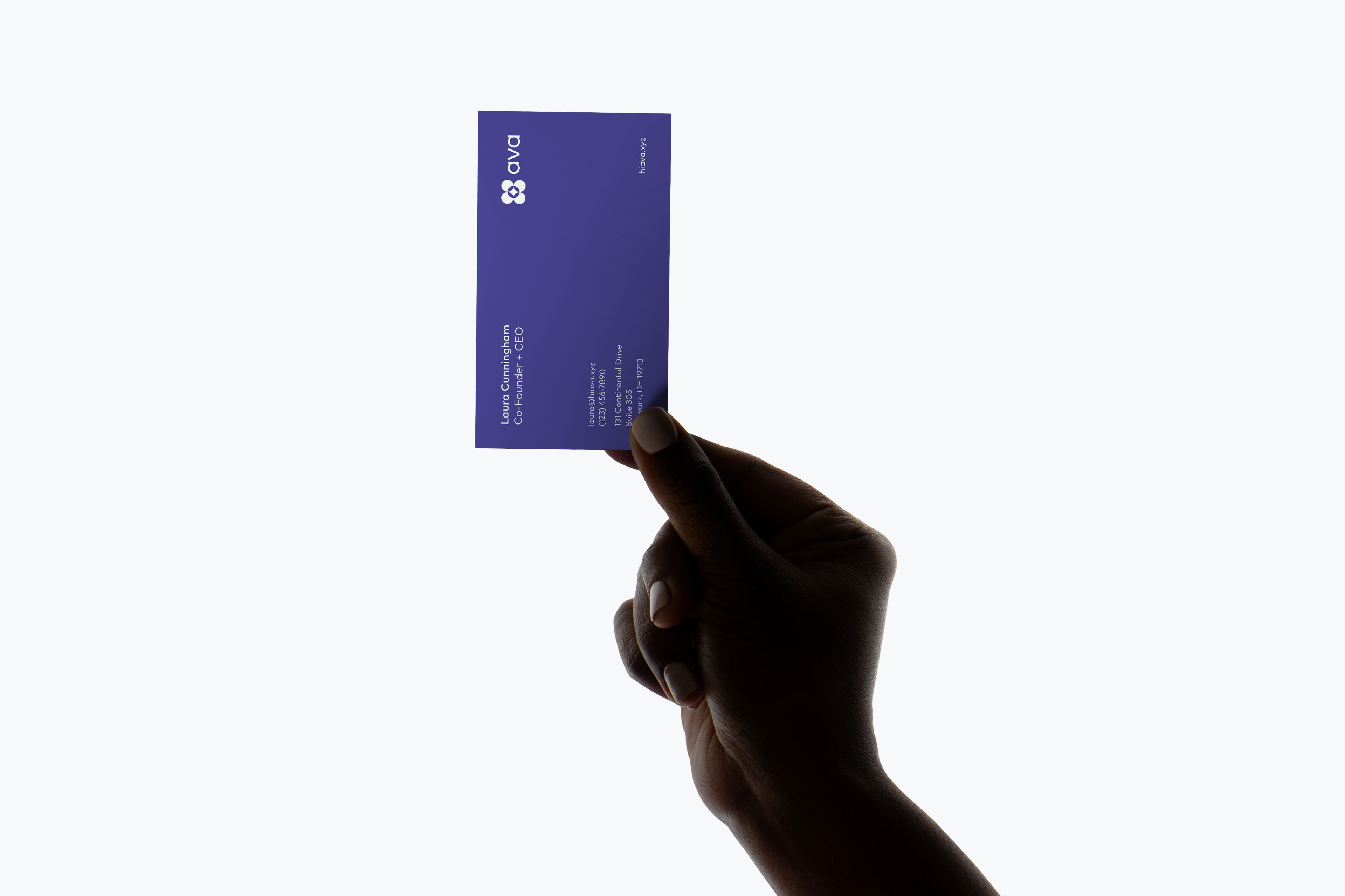 Indigo Ava business card held in hand, showing the logo, co-founder's name, and contact details